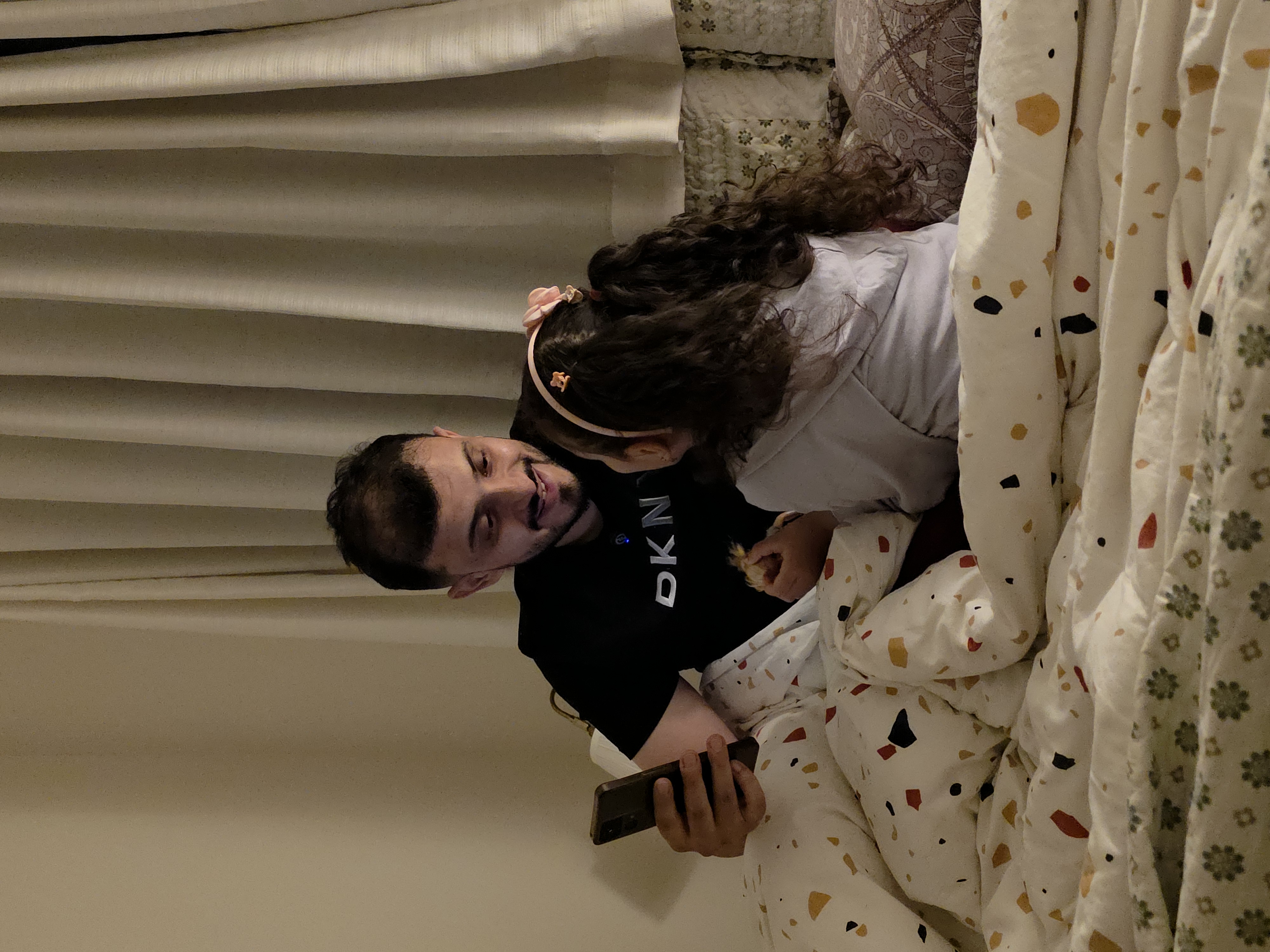 Saud, the founder of HeartNight, sharing a quiet moment with his daughter at bedtime